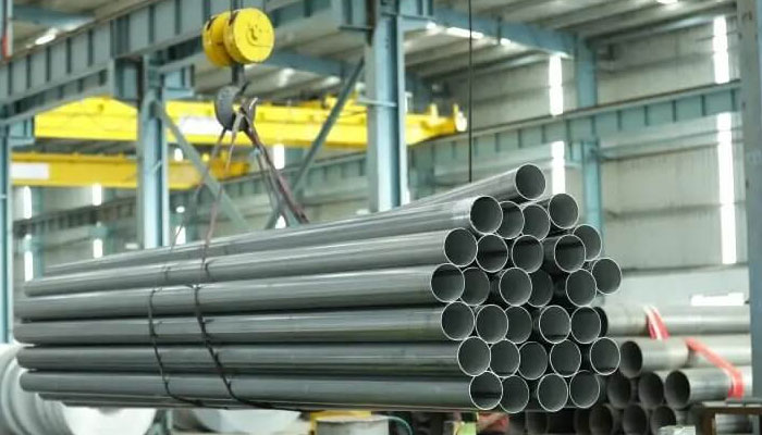 Stacked welded stainless steel pipes and tubes by Sun Mark Stainless for durability and high-performance industrial use.